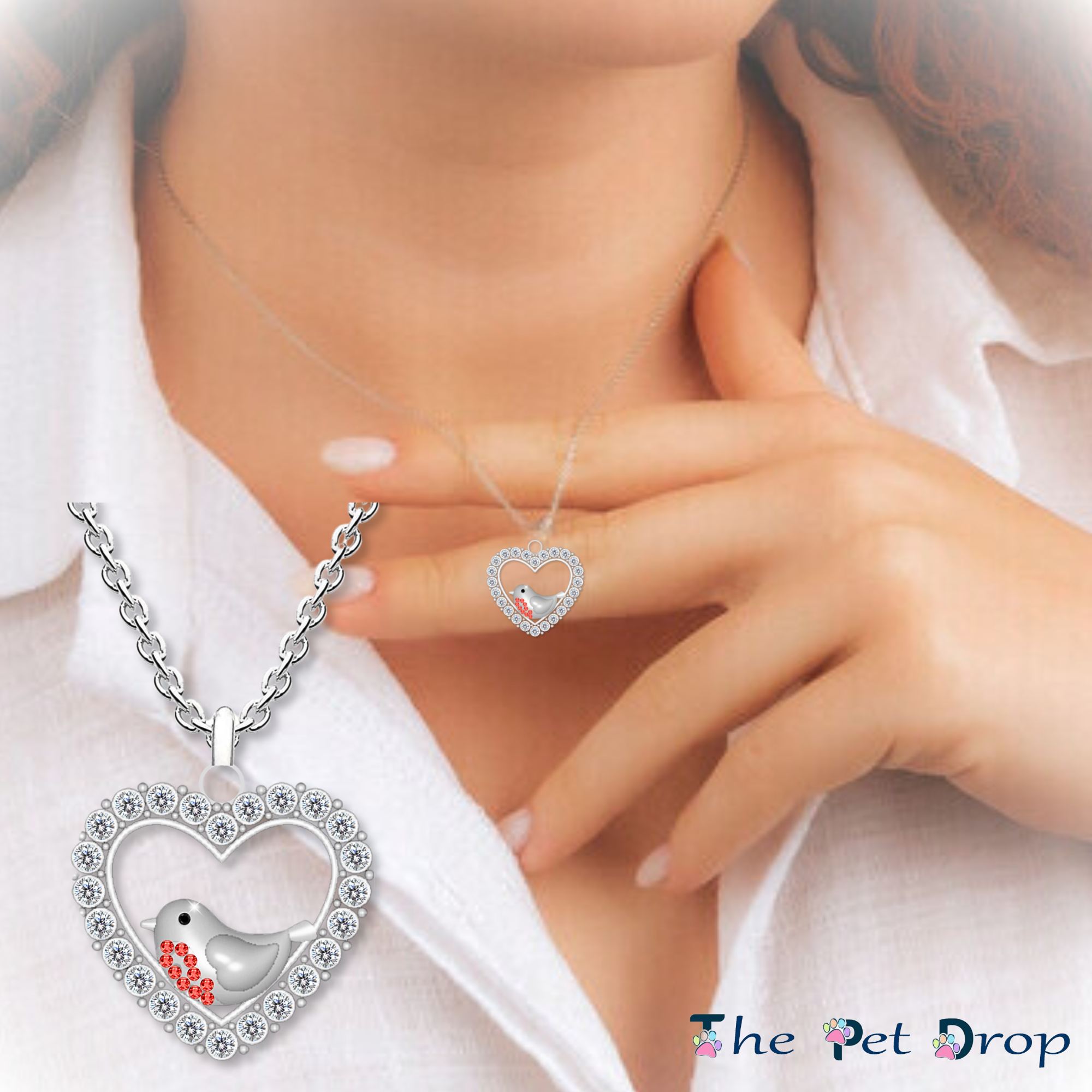 A Robin's Love Necklace. Silver heart shape with white crystals around the edge. Featuring a robin with 9 red crystals on its breast