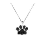 black crystal paw print silver pendant hanging on a silver chain