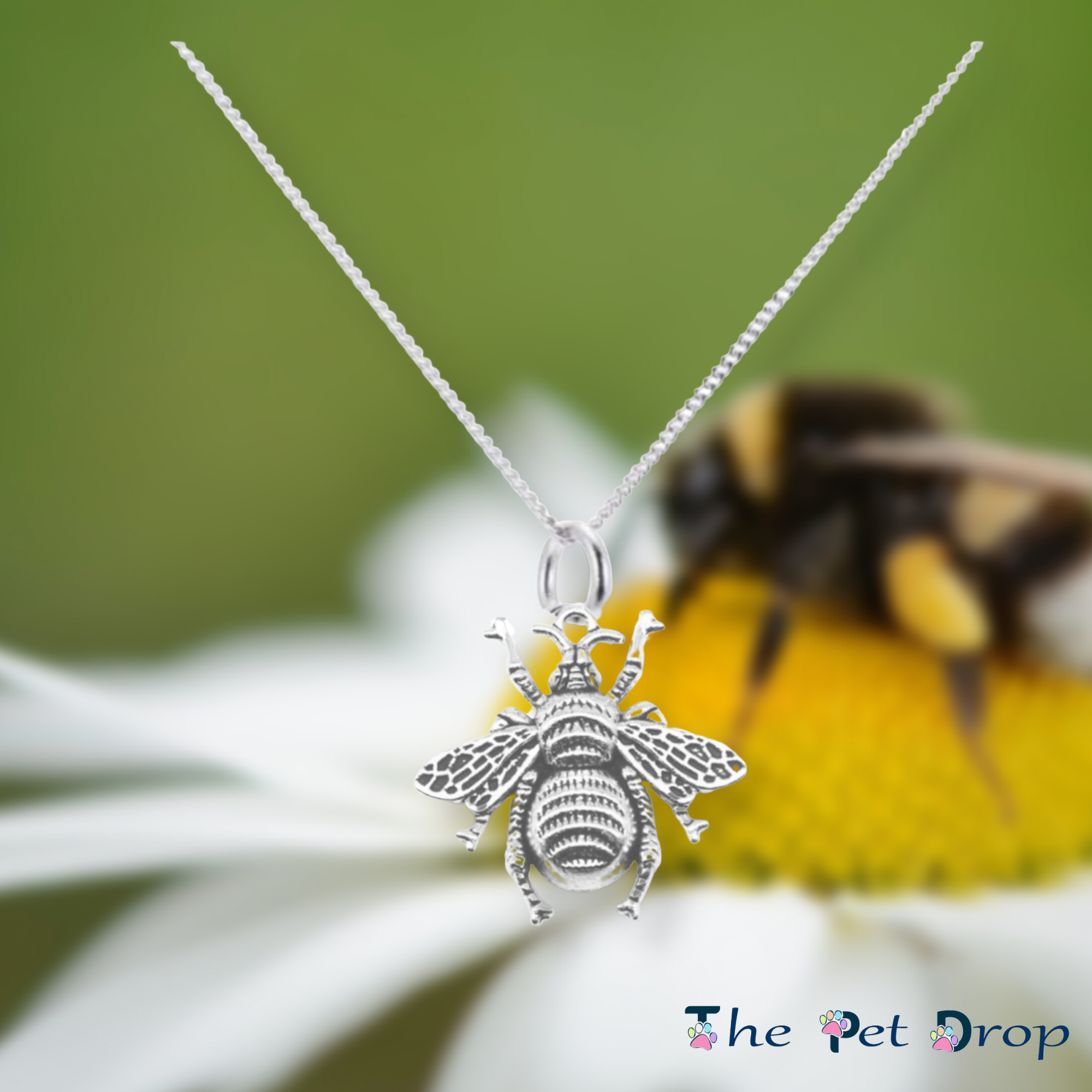 silver bumblebee pendant hanging on a silver chain