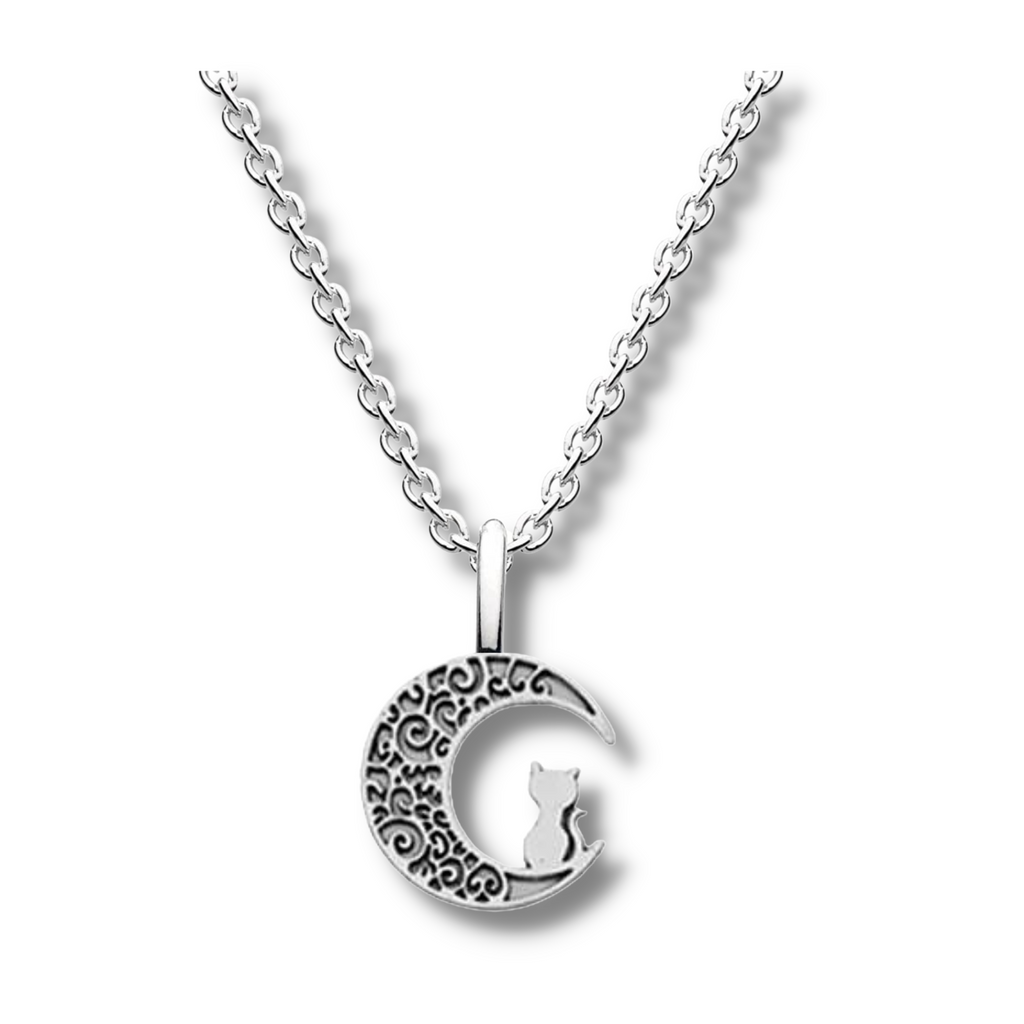 silver patterned moon pendant with a cat sitting on it hanging on a silver chain.
