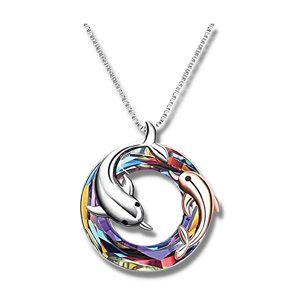 colourful crystal circle with one silver dolphin and a smaller rose gold dolphin in and around the circle pendant hanging on a silver chain.