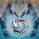 colourful crystal circle with one silver dolphin and a smaller rose gold dolphin in and around the circle pendant hanging on a silver chain.