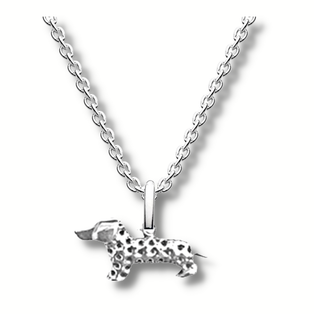 silver 3d little standing dachshund pendant with hole patterns all over its body excluding his head hanging on a silver chain.