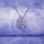 2d silver doberman silver necklace pendant with a heart shaped hole in its chest, hanging on a silver chain.