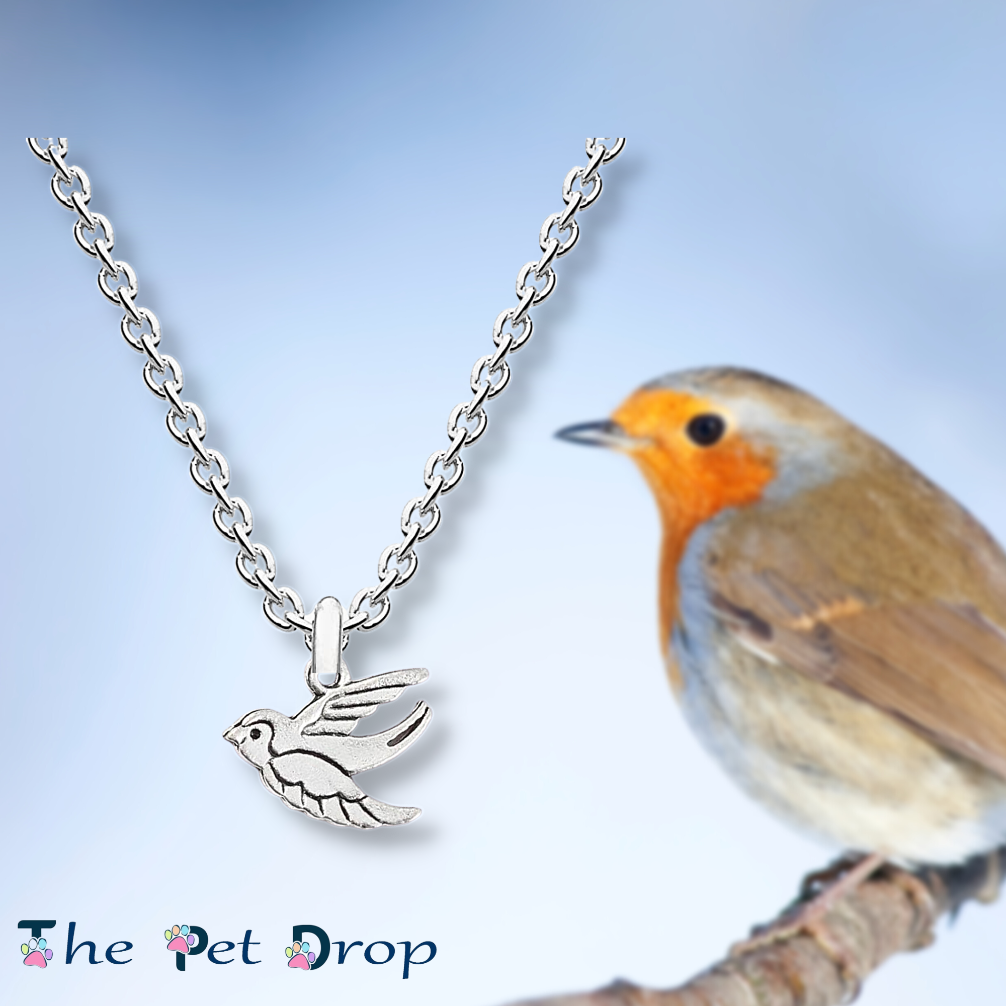 silver flying robin necklace pendant hanging on a silver chain