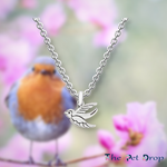 silver flying robin necklace pendant hanging on a silver chain