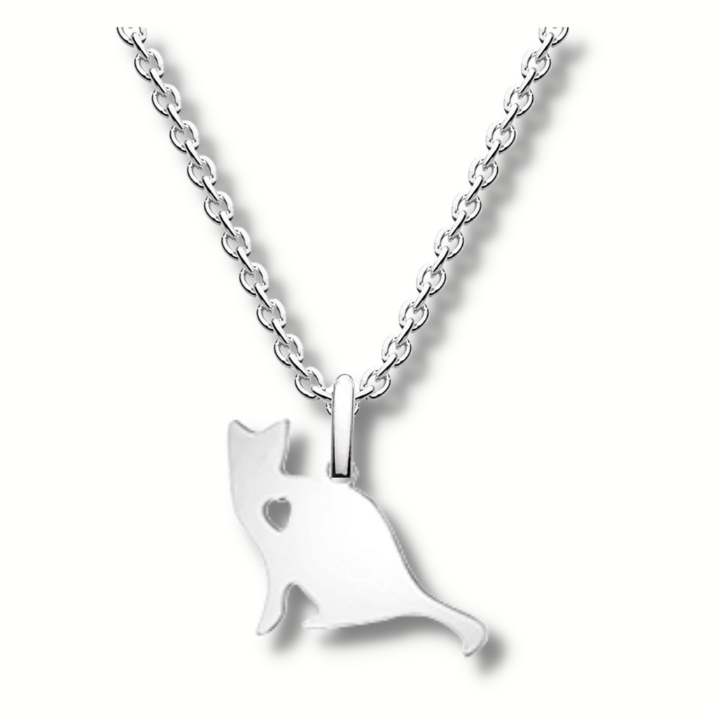 silver sitting cat pendant with a heart shaped hole in its shoulder area hanging on a silver chain.