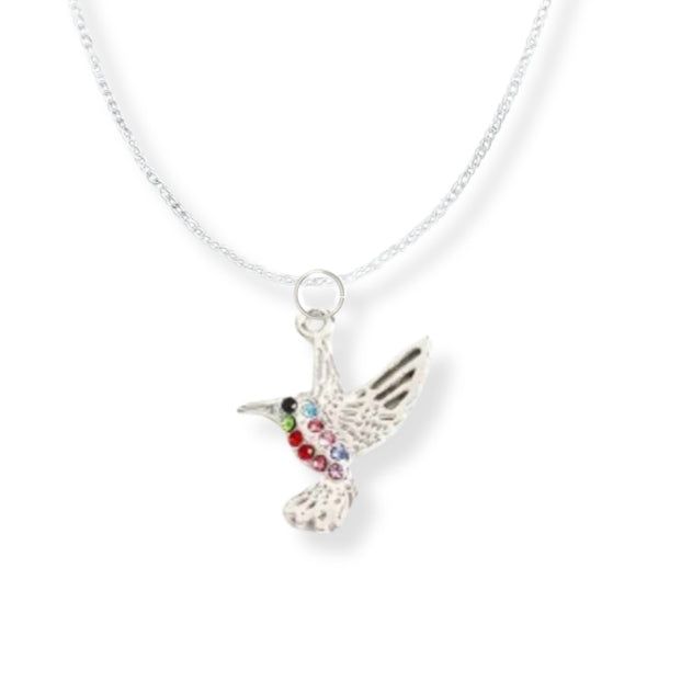 silver bird pendant with different coloured crystals hanging on a silver chain.