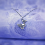 cute silver detailed duck necklace pendant hanging on a silver chain